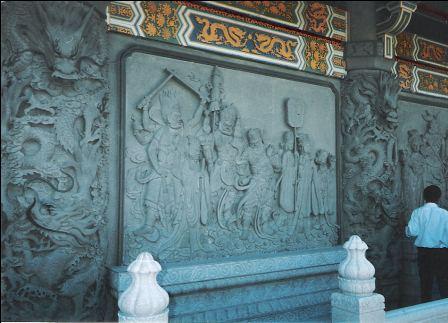 Stone craft on the wall of the Po Lin Monastery building